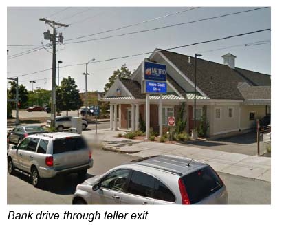 This is a photo of the driveway for exiting the bank’s drive-through teller window. The exit is located on Western Avenue, approximately 35 feet from the stop line.