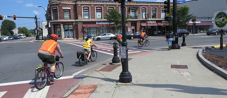 NO-HEAT Project banner showing people walking and biking in shaded areas